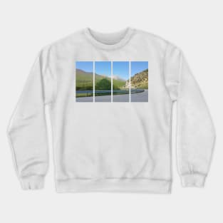 A static shot from the panoramic point Castaldia di Piancavallo; road to the tunnel inside the hill. Beautiful nature in a spring sunny day; no people around Crewneck Sweatshirt